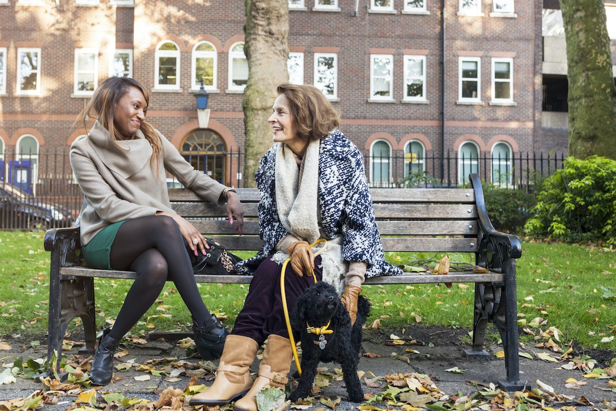 Young and senior woman in a park (London UK)