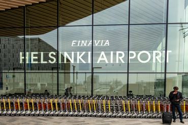Helsinki, Finland April 14, 2025 A man stands outside the departures terminal at Helsinki Airport.